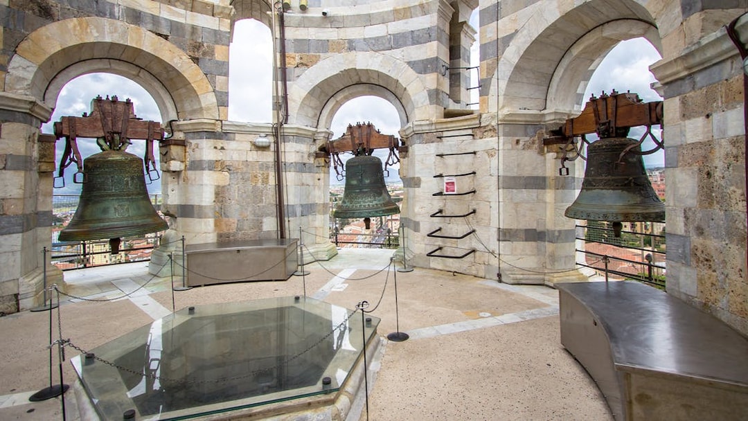 Leaning Tower of Pisa bell chamber with city view, part of Florence and Pisa tour.