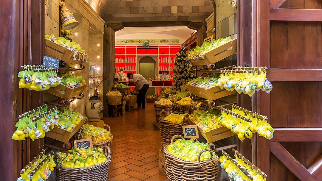 Lemon-themed shop interior in Positano, part of a guided day trip from Rome.