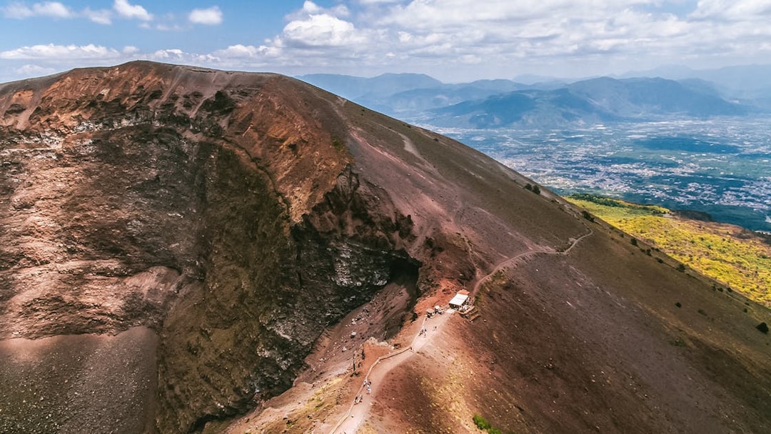 Hiking trail along the crater of Mount Vesuvius, Italy, with panoramic views.