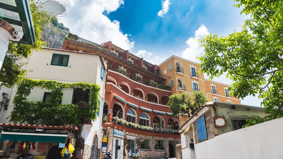 Colorful buildings along a road in Positano city center, Italy.