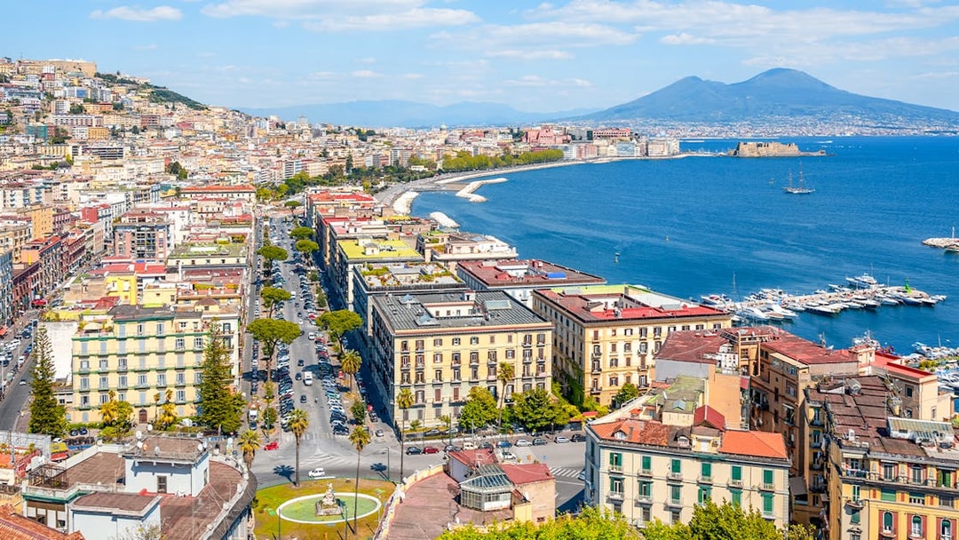Panoramic view of Naples cityscape with Mount Vesuvius in the background, Italy.