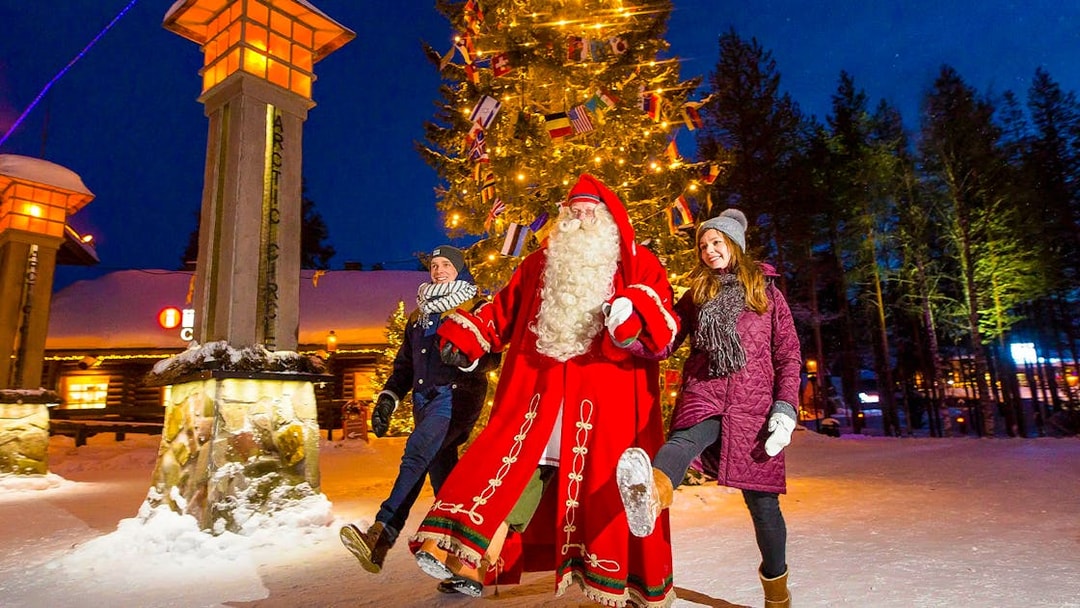 Children with Santa Claus at Santa Claus Village, Rovaniemi, Finland.