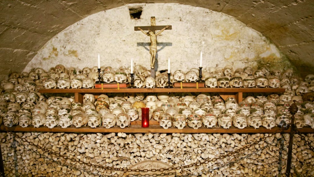 Painted skulls and bones in Hallstatt's Beinhaus, Austria.