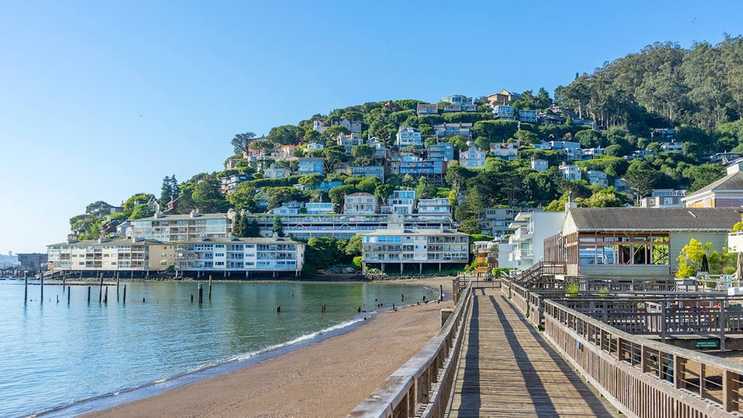 Wooden pier leading to hillside homes in Sausalito near San Francisco, CA.