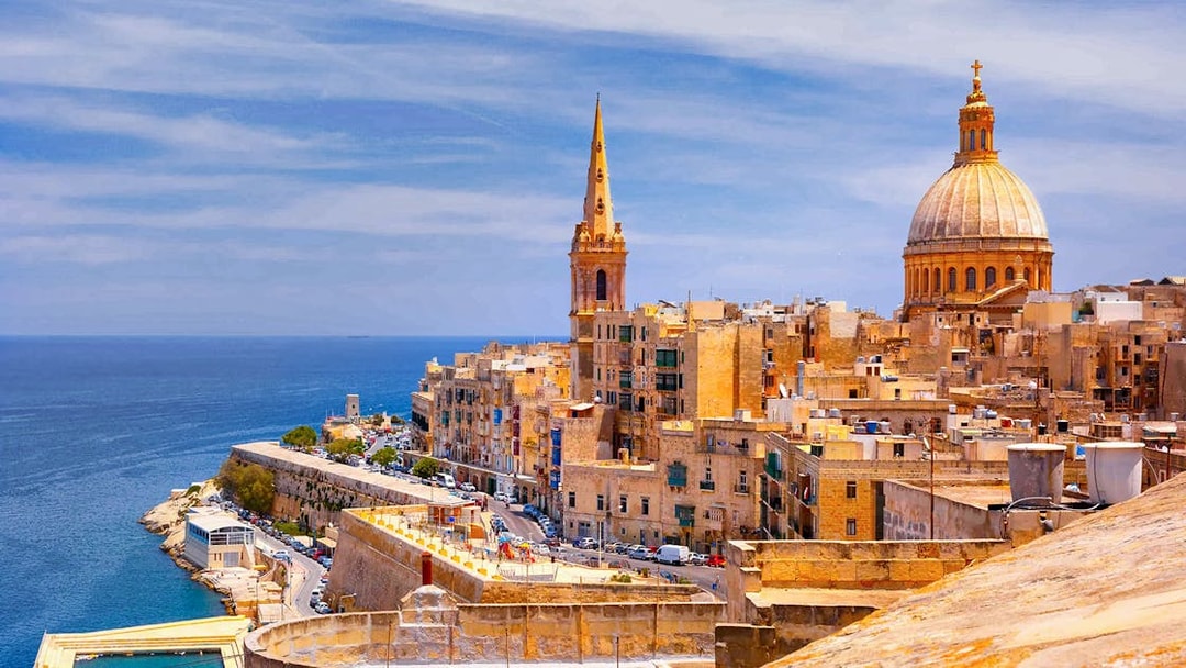 Valletta skyline with St. Paul's Cathedral and the Mediterranean Sea, Malta.