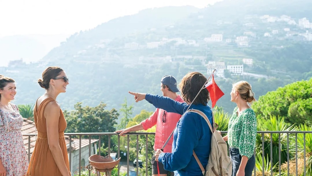 Tour group enjoying scenic view in Positano during guided tour from Sorrento.