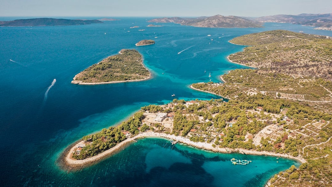 Aerial view of the Blue Lagoon with surrounding islands and clear blue waters.