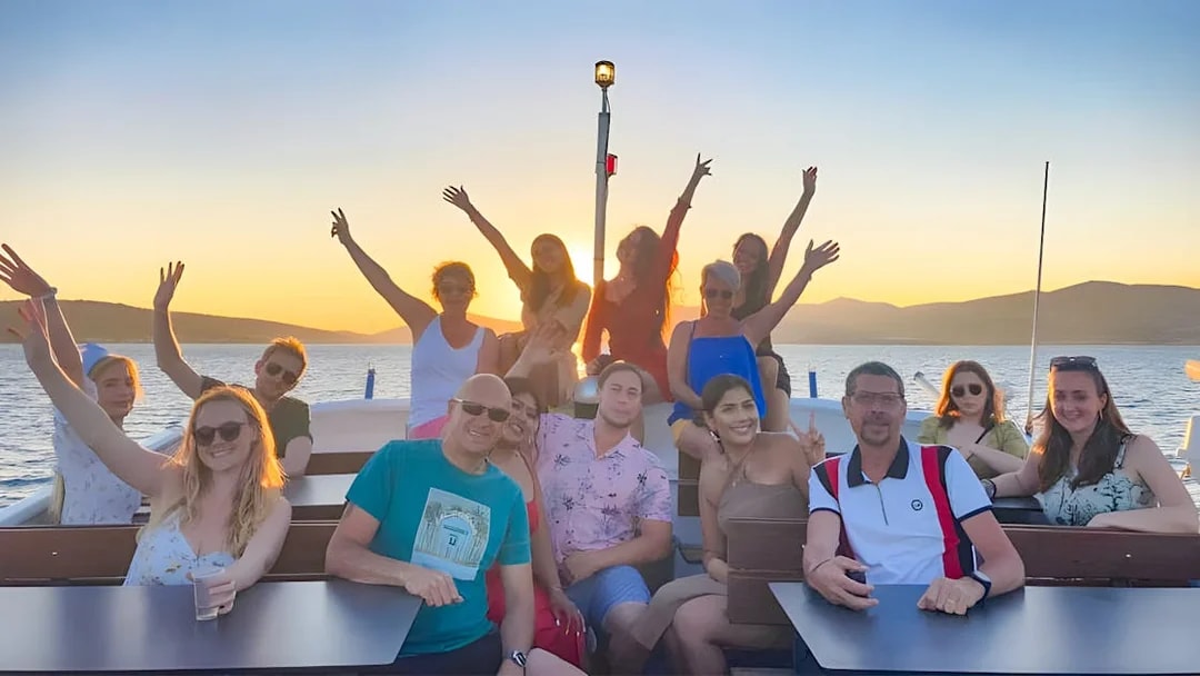 Group enjoying sunset on a boat during Split: Hvar & 3 islands cruise.