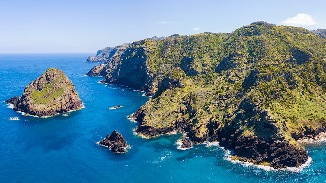 Santa Maria Cliffs in Malta with rugged coastline and clear blue sea.