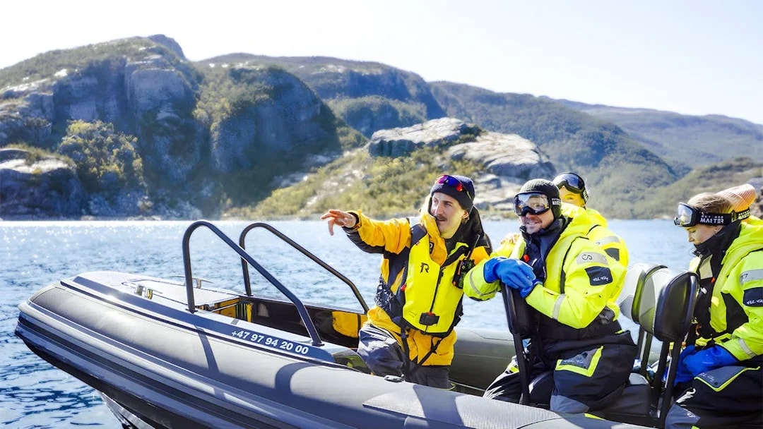 Guests on RIB boat with guide during Lysefjord Safari, Norway.