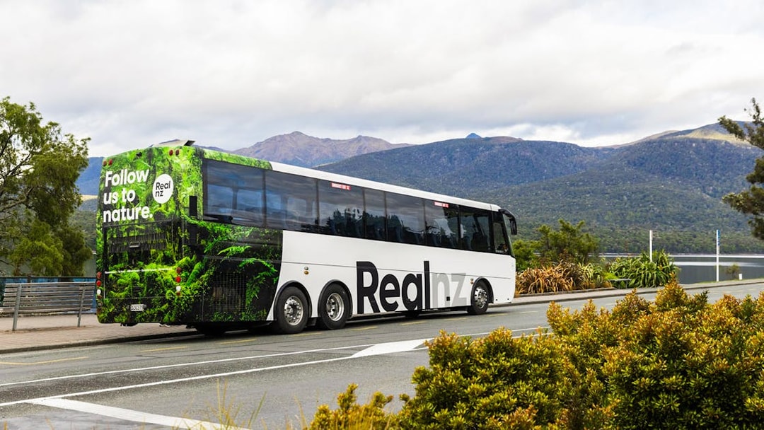 Tour bus for Te Anau Premium Doubtful Sound Cruise in New Zealand's fjords.