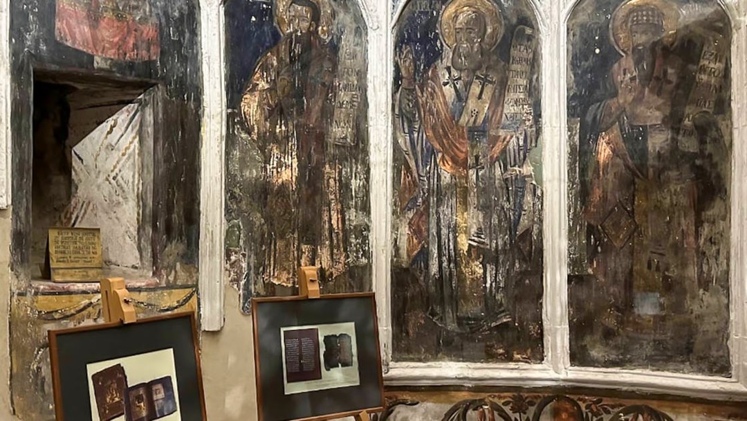 Frescoes and framed artifacts inside Berat Castle, Albania.