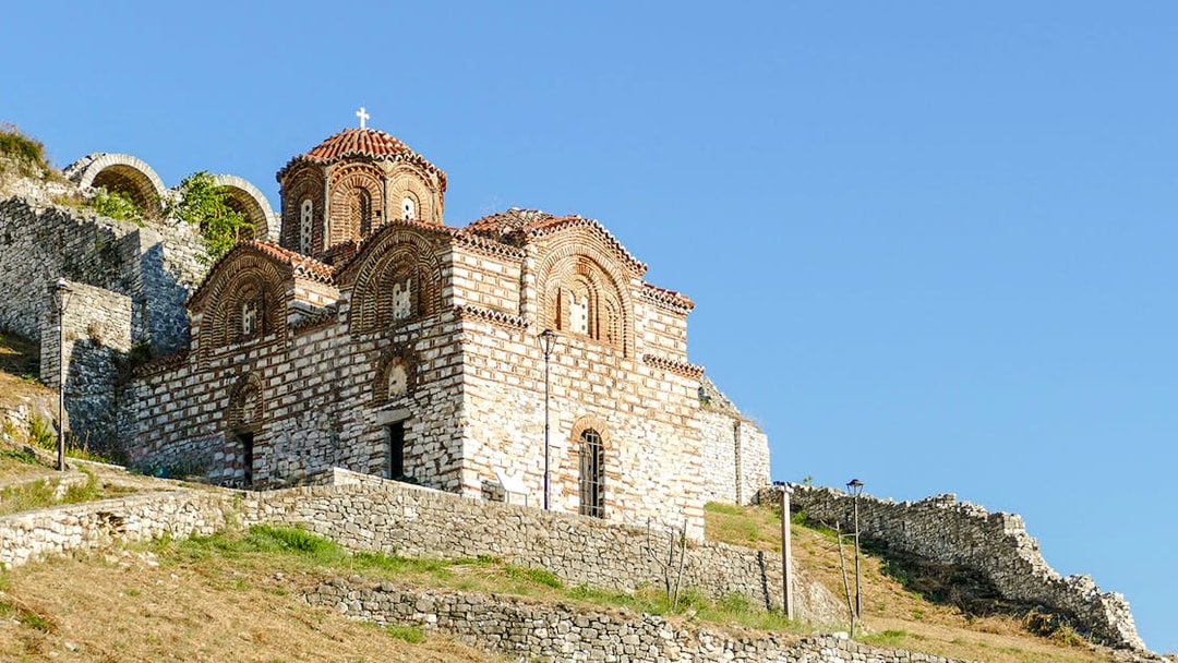 Old church with red-tiled roof in the Castle of Berat, Albania.