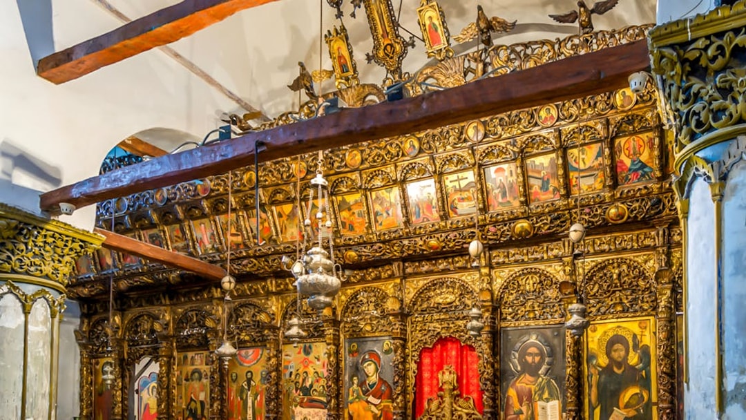 Ornate wooden iconostasis with religious paintings inside Berat Castle, Albania.