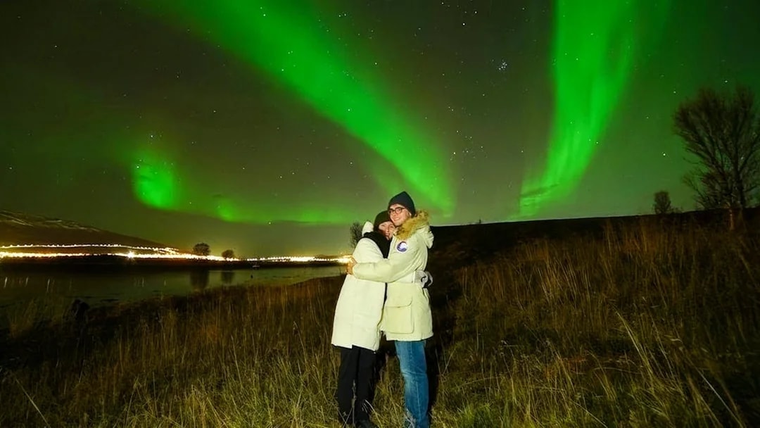 Tourists viewing Northern Lights on Small Group Northern Lights Chase Tour.