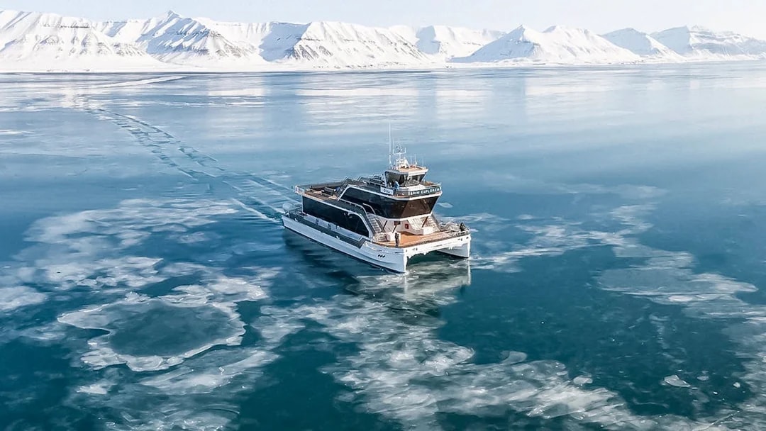 Hybrid electric boat on icy waters during Silent Whale Watching Tour from Tromso.