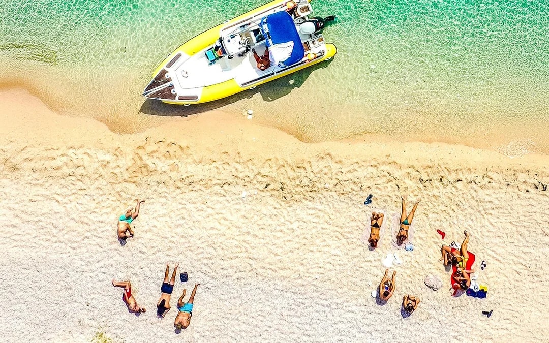 From Vlore: Unknown Escape Party Boat Cruise with Drinks, Music & Secret Swim Stops Image 6
