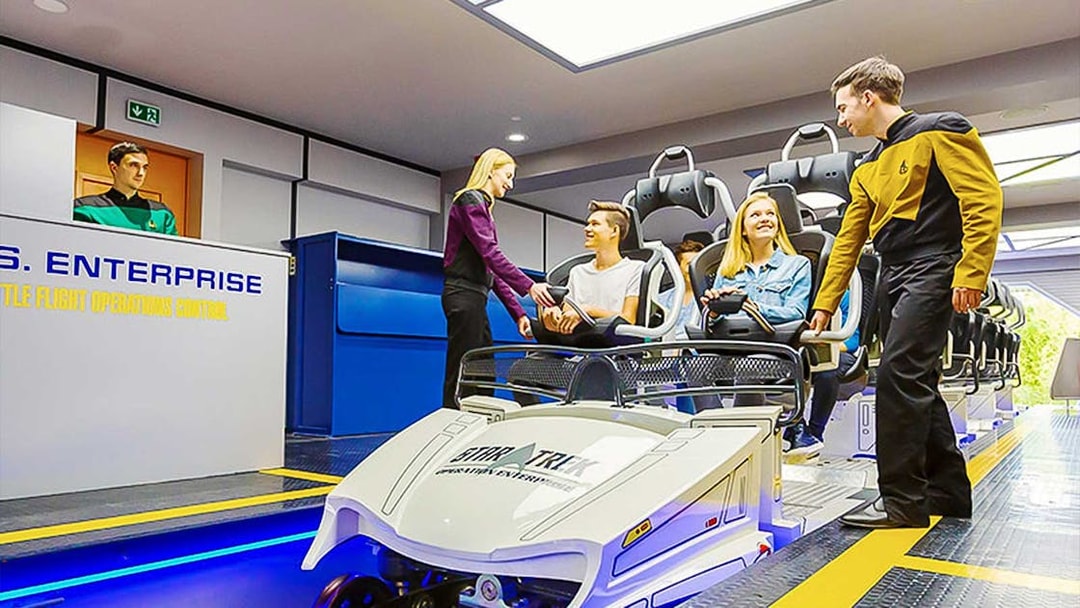 Guests boarding Star Trek: Operation Enterprise ride at Movie Park.