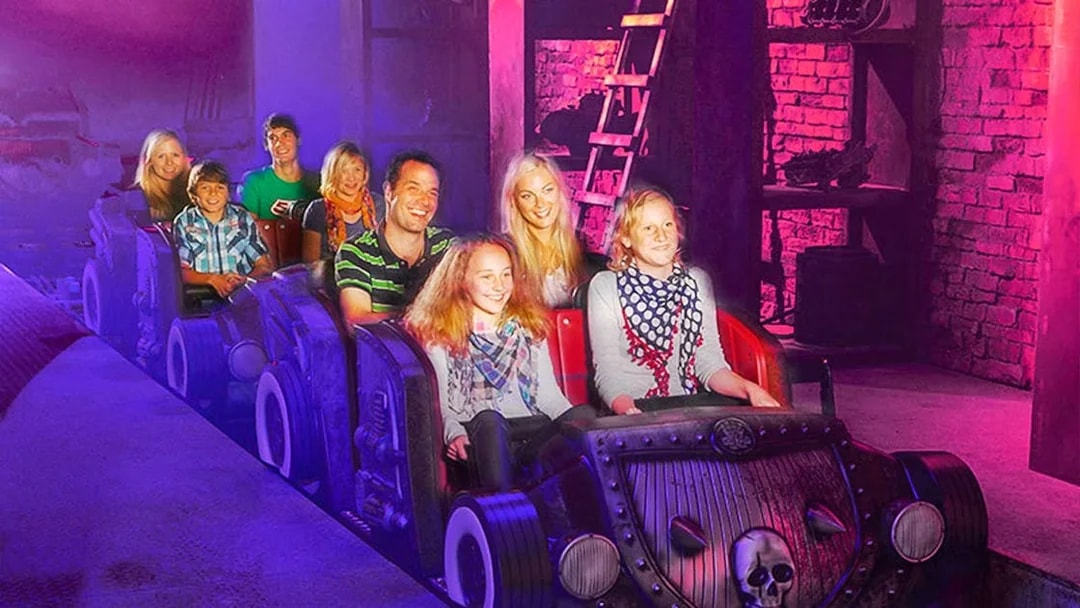 Visitors on a themed ride at Van Helsing's Factory, Movie Park.