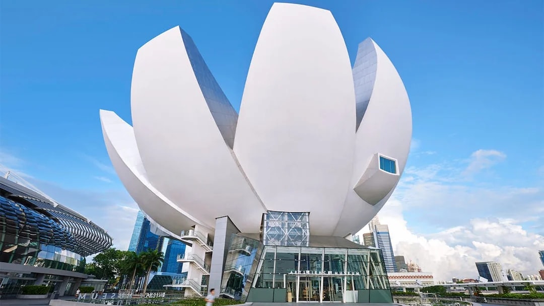 ArtScience Museum exterior in Singapore, featuring lotus-inspired architecture under a clear blue sky.