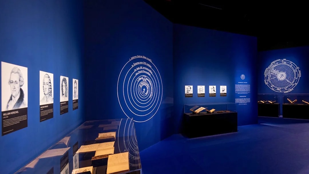 Exhibition room with historical portraits and books at Singapore Future World Exhibition.