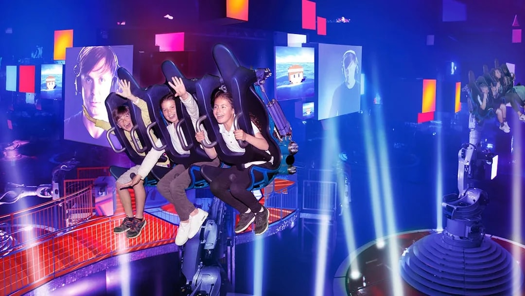 Visitors enjoying the Dances with Robots attraction at Futuroscope, France.
