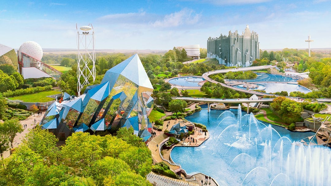 Futuristic architecture and water features at Futuroscope theme park in France.