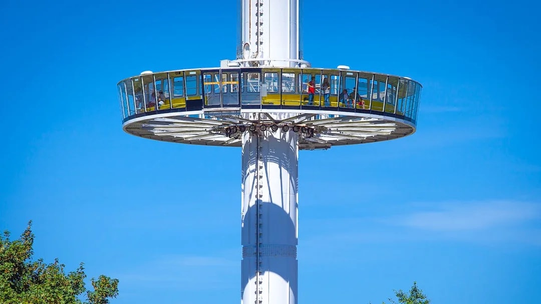 Gyrotour ride at Futuroscope, France, with passengers enjoying panoramic views.
