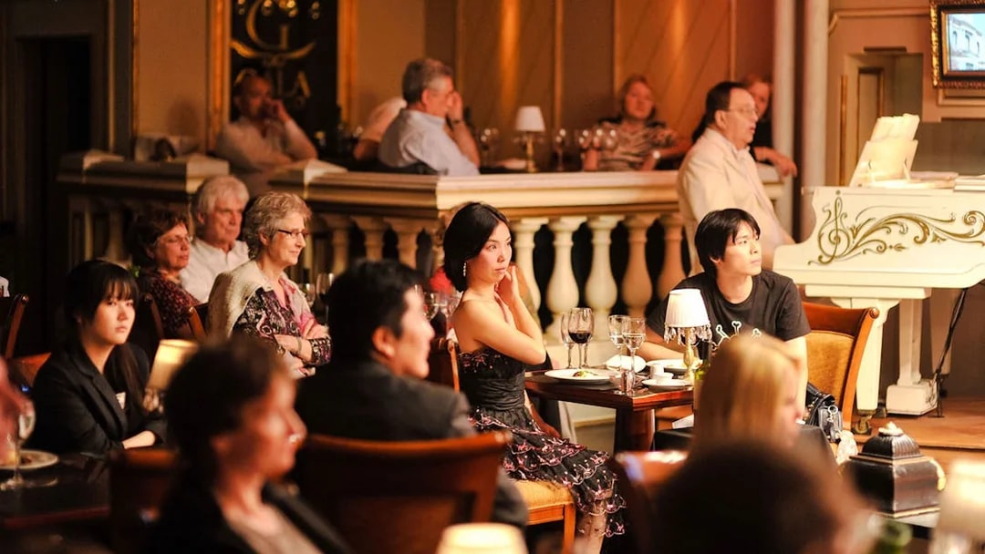Audience enjoying a live performance at Gala Tango Show in Buenos Aires.