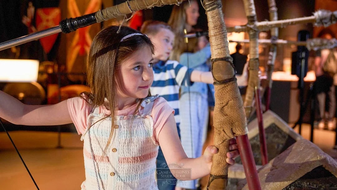 Children practicing archery at Game of Thrones Studio Tour.