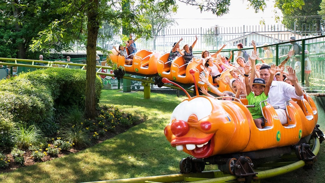 Children enjoying a caterpillar ride at Gardaland Park.