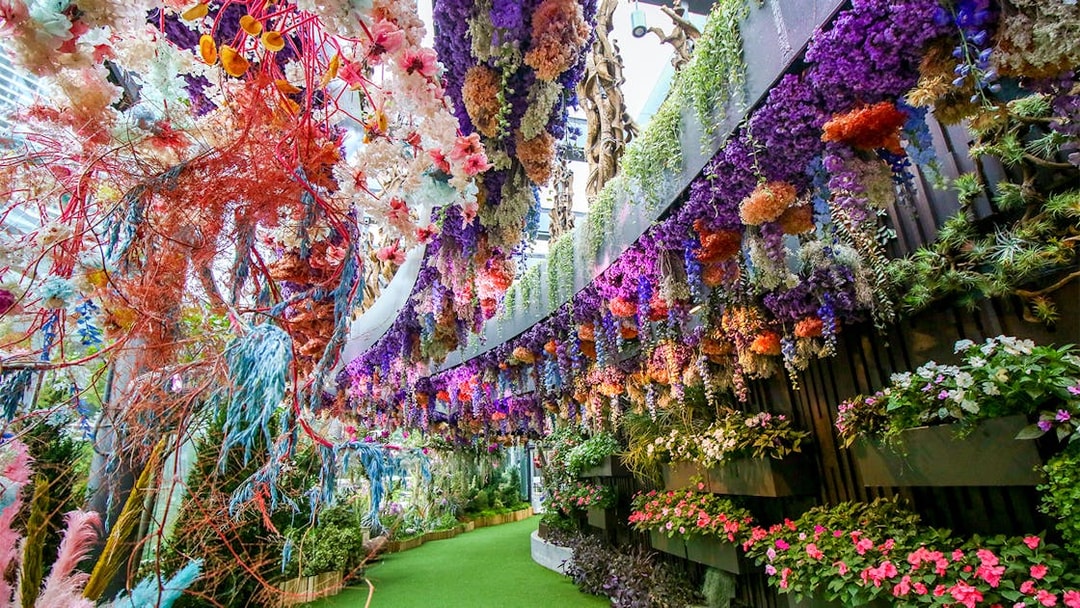 Floral Fantasy display with vibrant hanging flowers at Gardens by the Bay, Singapore.