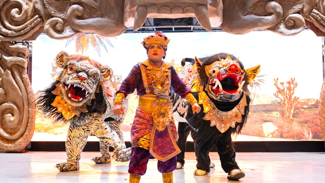 Garuda Wisnu Kencana cultural dance performer with traditional costumes and mythical creatures.