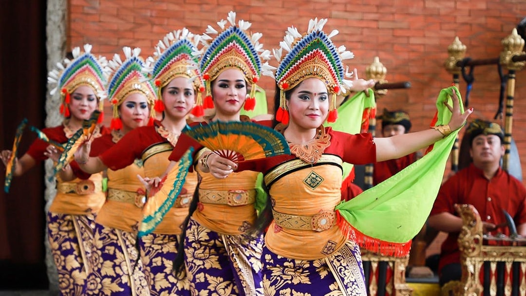 Balinese dancers performing at Garuda Wisnu Kencana Culture Park in Bali.