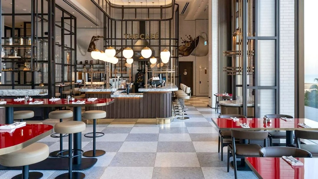 Dining area at Gastronomy, Dubai with modern decor and red tables.