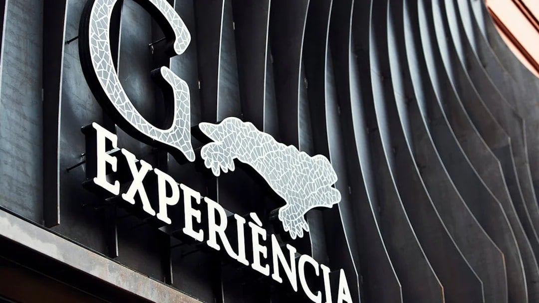 Gaudí 4D Experience sign with mosaic design in Barcelona.