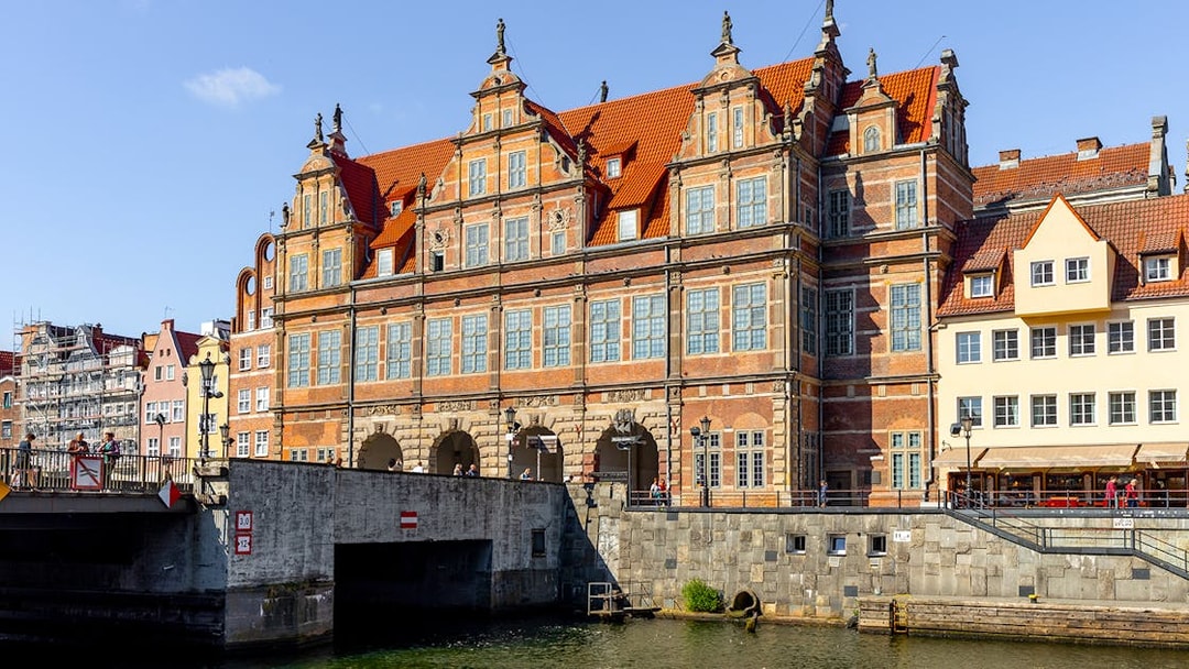 Historic building along the Motława River in Gdansk, Poland, viewed from a kayak.