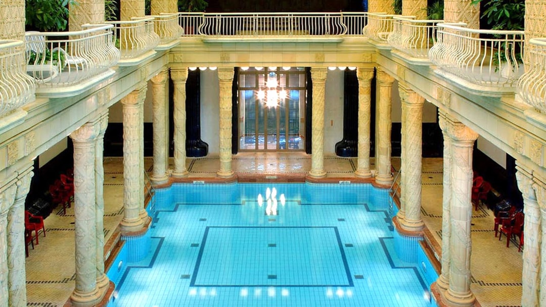 Indoor pool with ornate columns at Gellert Spa, Budapest.