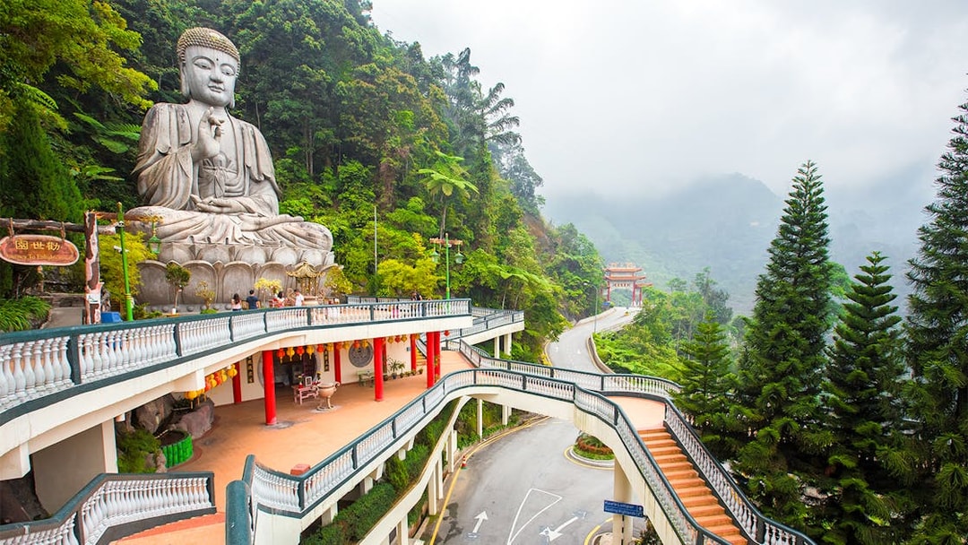 Buddha statue and temple walkway in Genting Highlands, Malaysia.