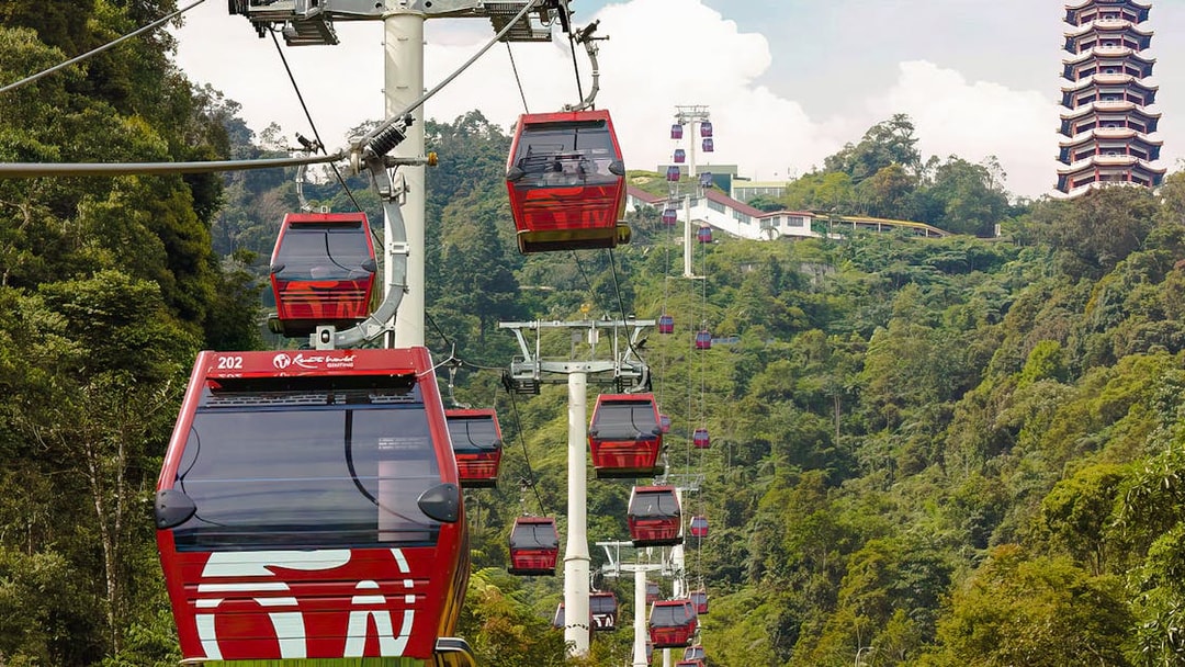 Genting Awana SkyWay gondola cable cars with Chin Swee Caves Temple in the background.