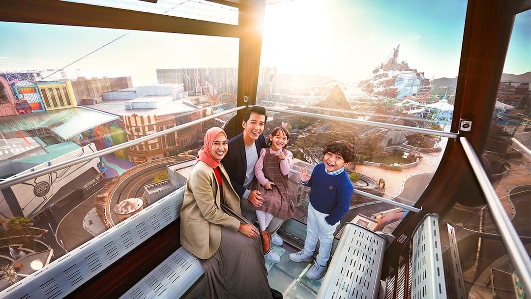 Family enjoying view inside Genting Awana SkyWay Cable Car, Malaysia.