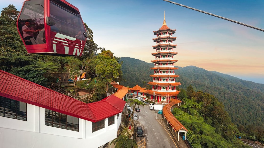 Genting Awana SkyWay gondola with Chin Swee Caves Temple in the background, Malaysia.