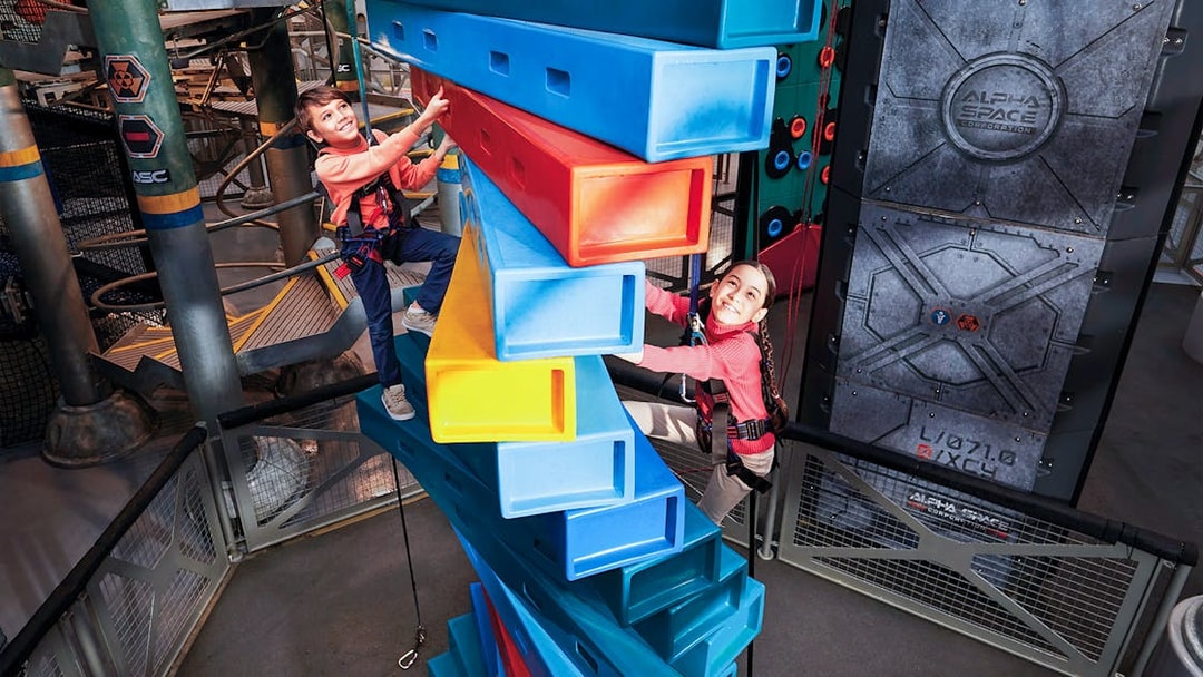 Children climbing colorful blocks at Genting SkyWorld Outdoor Theme Park.