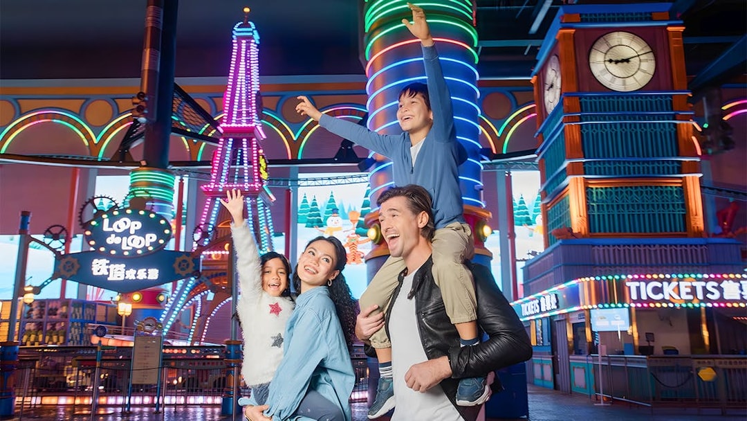 Family enjoying rides at Genting Skytropolis Indoor Theme Park, Malaysia.