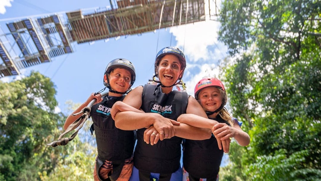 Family enjoying the Cairns Giant Swing experience in Australia.