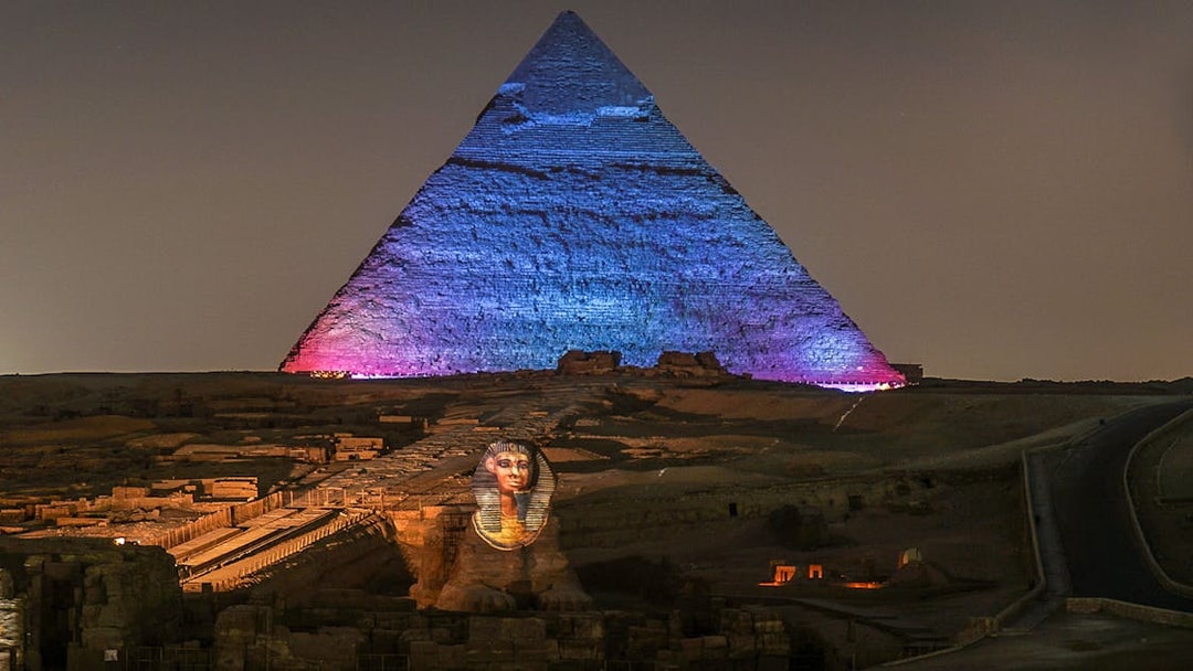 Great Pyramids of Giza illuminated during Sound and Light show, Egypt.