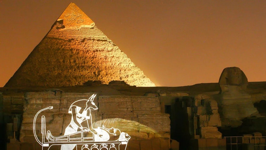 Pyramid of Khafre illuminated at night with laser show in Giza, Egypt.