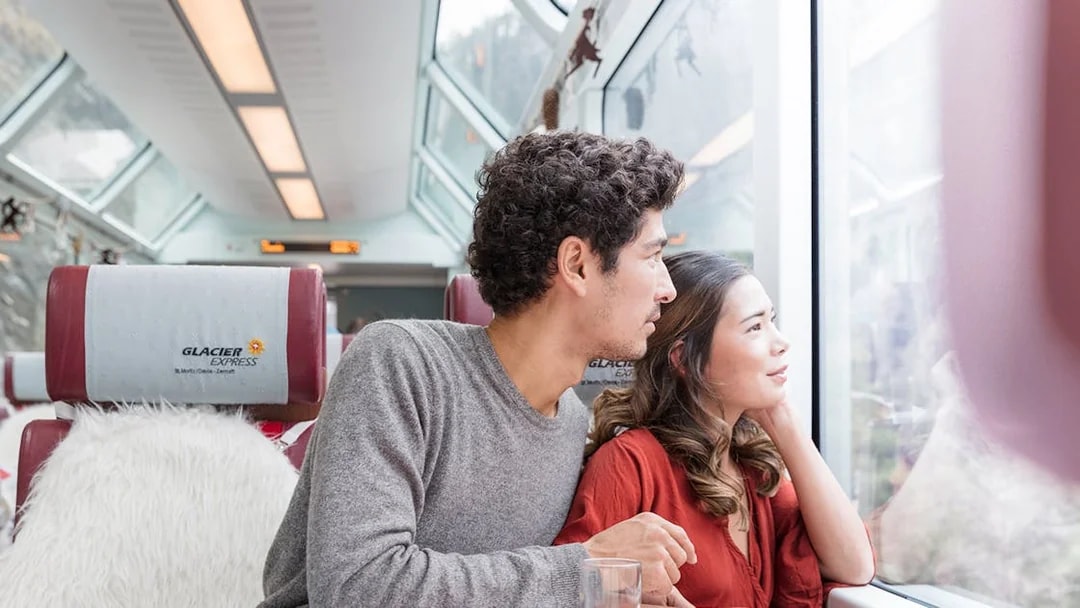 Passengers enjoying scenic views on the Glacier Express, Interrail Switzerland.