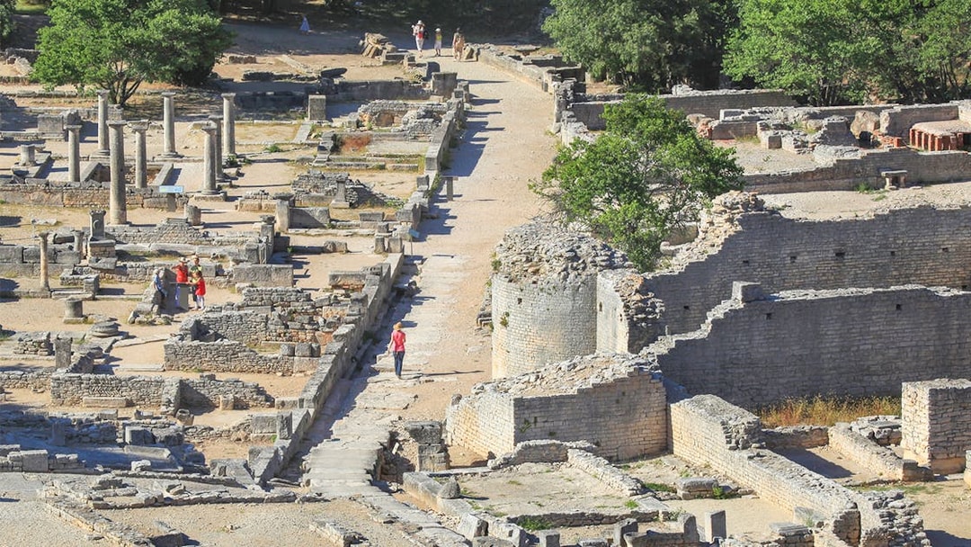 Ancient ruins and columns at Glanum Archaeological Site in Saint-Rémy-de-Provence, France.