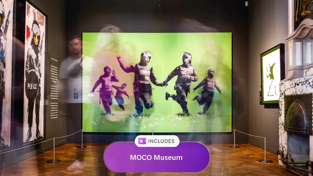 MOCO Museum Amsterdam art exhibit with vibrant green artwork and visitors.